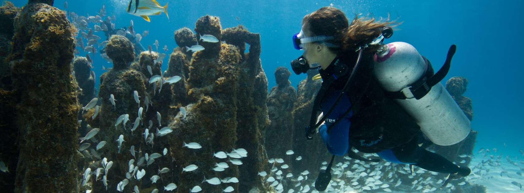 Scuba Diver near Underwater Statues