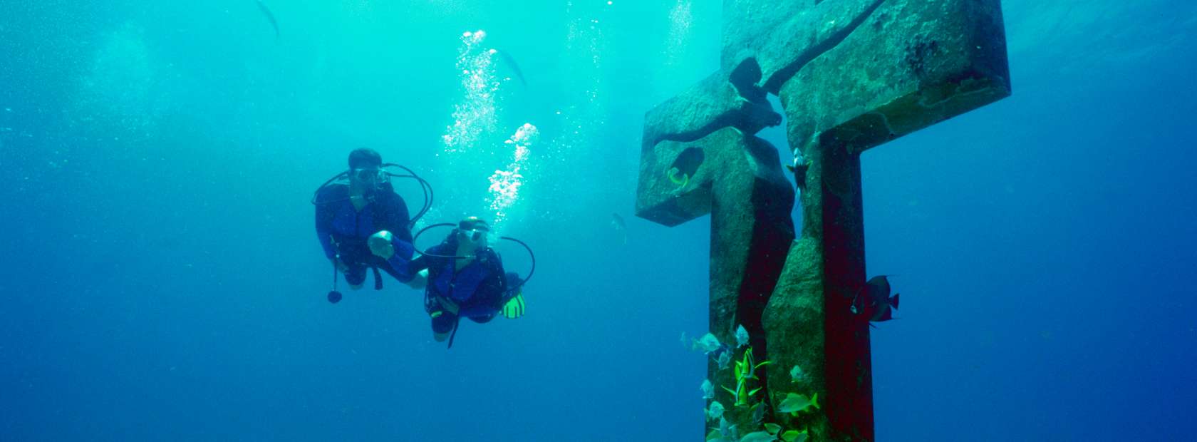 Divers by Underwater Statue