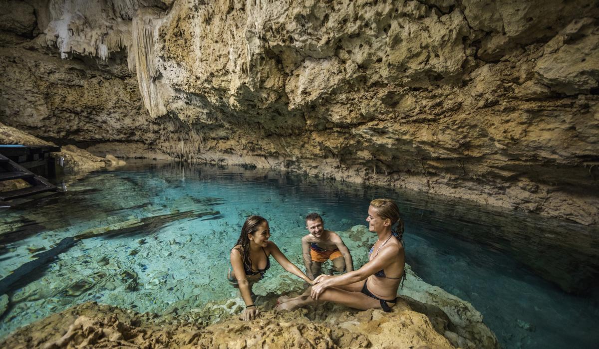 People Smiling in Cenote Grotto