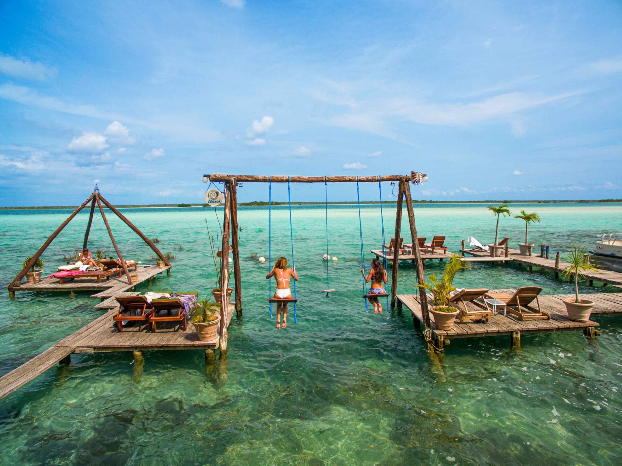 Wooden swings over the Bacalar lagoon
