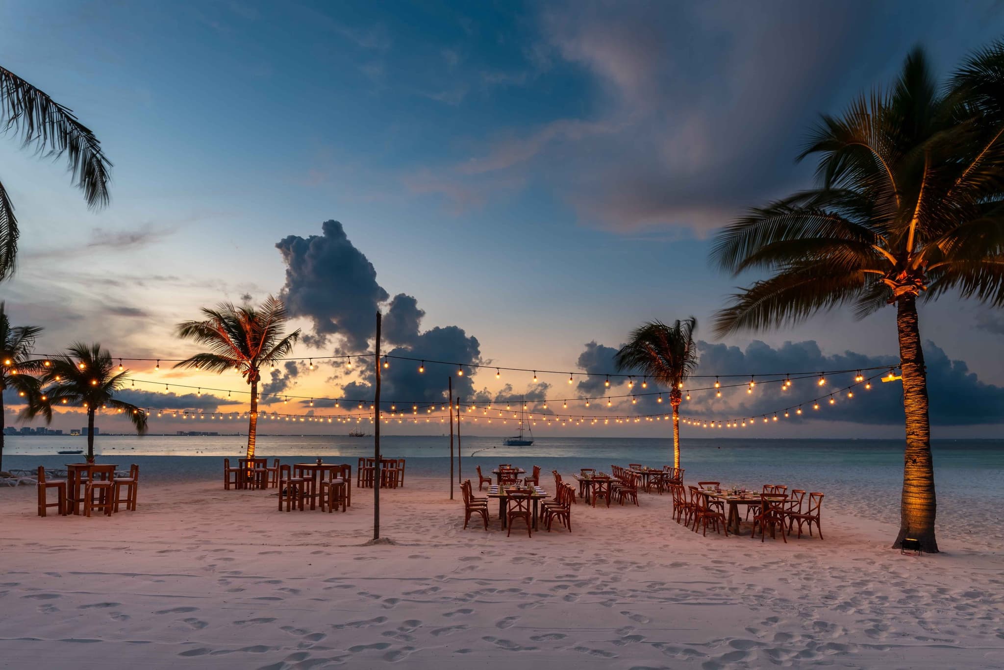 Beach dinner set-up at sunset