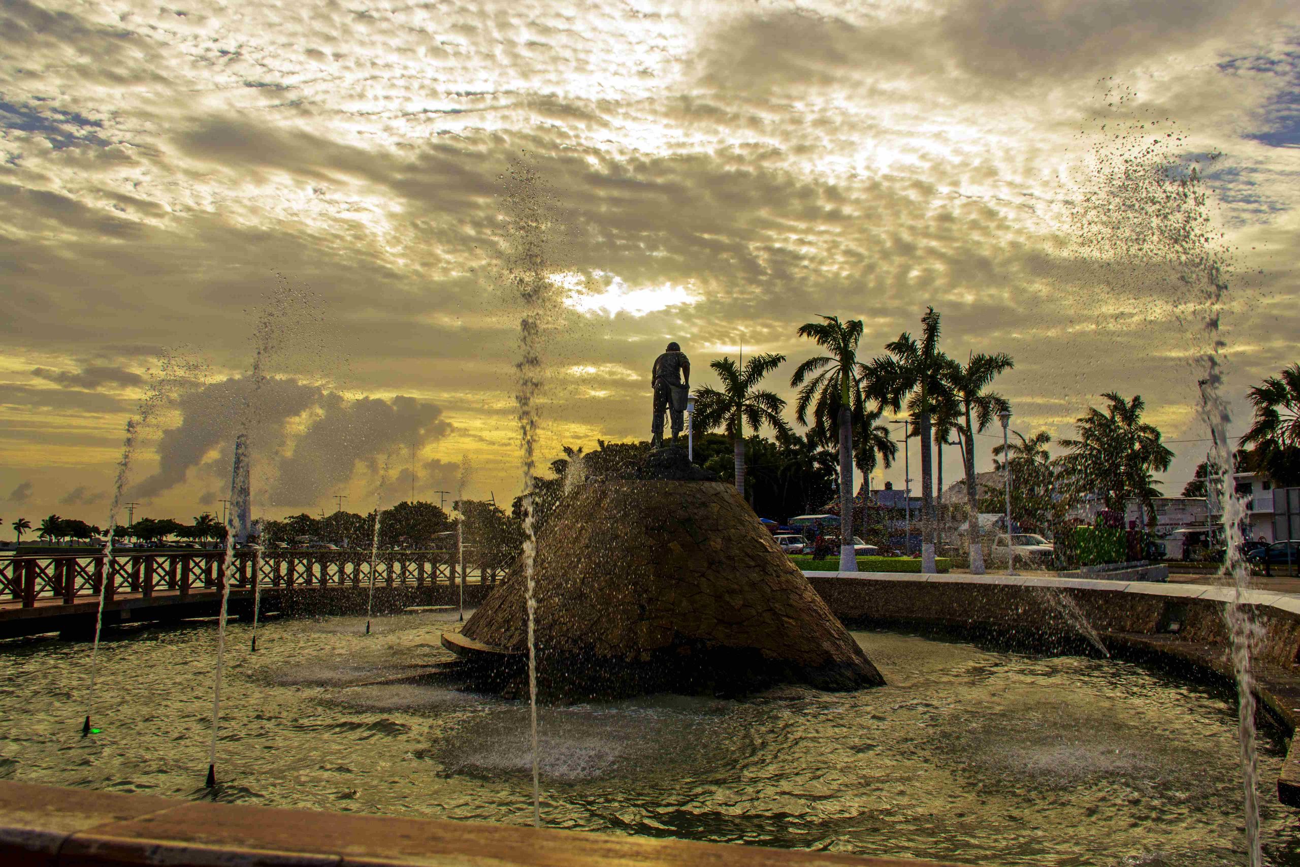 Fountains at the Chetumal waterfront monument at sunset